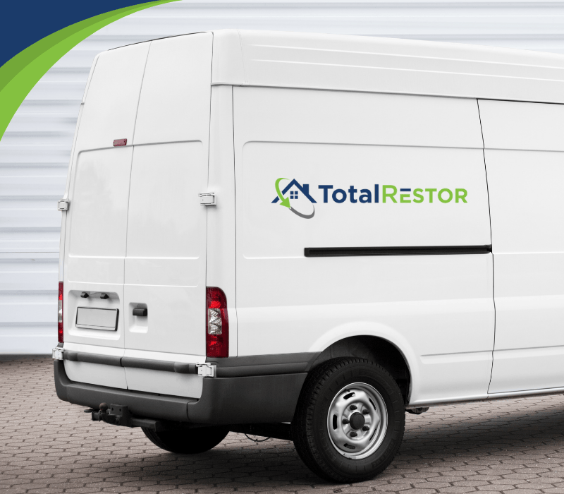 TotalRestor white van in front of garage